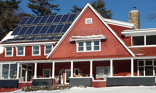 Maine House exterior - red house with solar panels